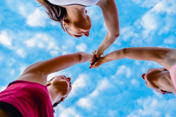Women high-fiving after exercise